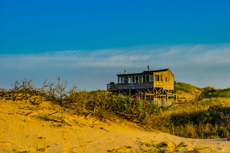 House among sand Dunes and Grass of the Provincelands Cape Cod MA USの写真素材
