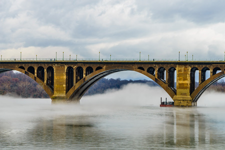 Francis Scott Key Bridge across Potomac River, winter fog on the waterの写真素材
