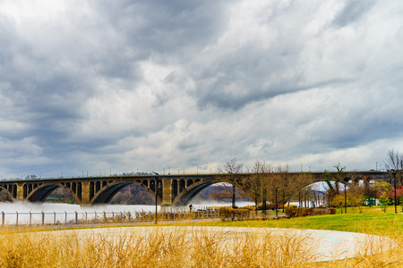 Francis Scott Key Bridge across Potomac River, winter fog on the waterの写真素材