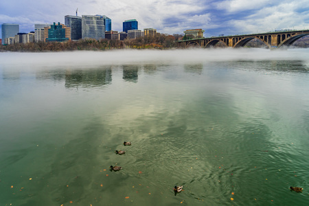 Francis Scott Key Bridge across Potomac River, winter fog on the water.の写真素材