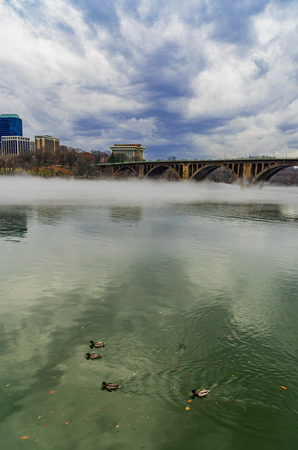 Francis Scott Key Bridge across Potomac River, winter fog on the waterの写真素材