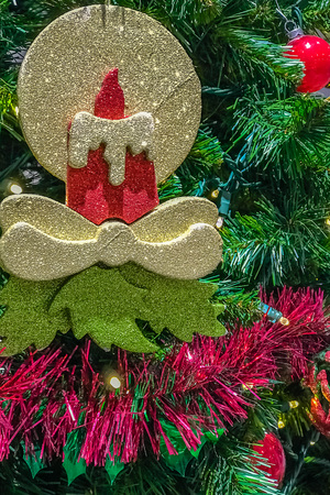 Christmas tree decorations and candle with red.の写真素材