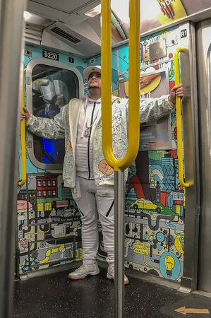 Brooklyn New York USA 08 March 2019 - very interesting man in a white suit in an amazing subway carのeditorial素材