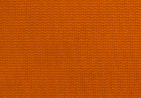 High resolution orange plastic fabric texture for background.の写真素材
