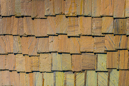 Exterior wall stone plates siding background textures.の写真素材