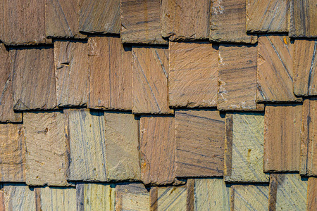 Exterior wall stone plates siding background textures.の写真素材