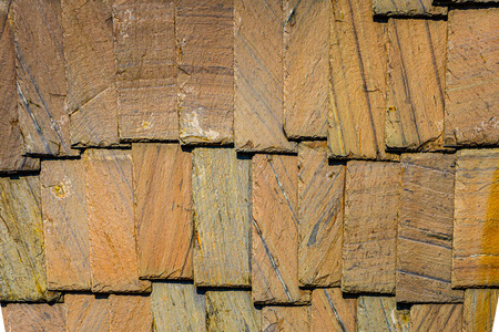 Exterior wall stone plates siding background textures.の写真素材