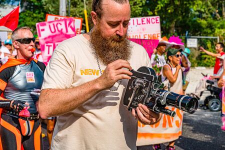 Provincetown, Massachusetts US - August 22, 2019 People walking in the Annual Provincetown Carnival Parade on Commercial Street.のeditorial素材