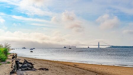 Beautiful waterfront, sky and clouds view of Gravesend Bay in Brooklyn, New York, USの写真素材