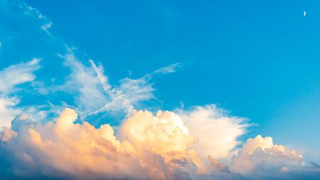 White clouds with blue sky on the sunset summer background.の写真素材