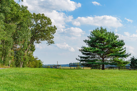 Amish country field agriculture, beautiful brown wooden fence, farm, barn in Lancaster, PA US.