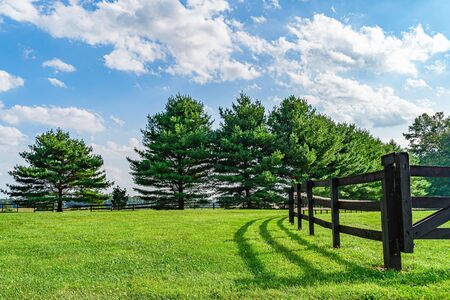 Amish country field agriculture, beautiful brown wooden fence, farm, barn in Lancaster, PA USの写真素材