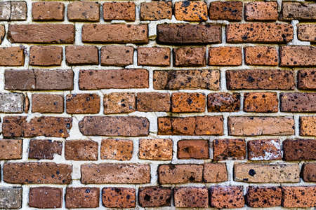 Old brick colored brick masonry whith natural hydraulic cement background textures from Fort Zachary Taylor Fortressの写真素材