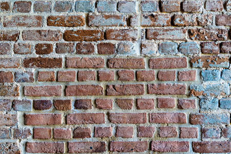 Old brick colored brick masonry whith natural hydraulic cement background textures from Fort Zachary Taylor Fortressの写真素材