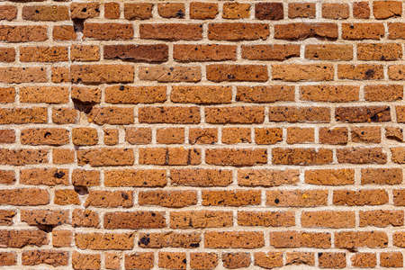 Old brick colored brick masonry whith european natural cement background textures from Fort Zachary Taylor Fortressの写真素材