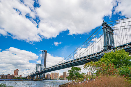 Manhattan Bridge over East River and waterfront condominium Manhattan New York City Wide angle view