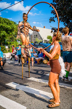Provincetown, Massachusetts US - August 22, 2019 People walking in the Annual Provincetown Carnival Parade on Commercial Street.のeditorial素材