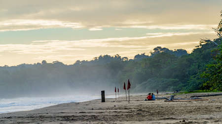 Sunrise at Playa Cocles, beautiful tropical Caribbean beach, Puerto Viejo, Costa Rica east coast, tourists meet the dawnの写真素材