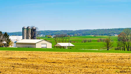 Amish country, farm, home and barn on field agriculture in Lancaster, Pennsylvania, PA US North Americaの写真素材