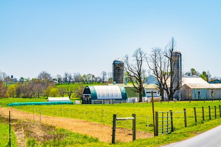 Amish country, farm, home and barn on field agriculture in Lancaster, Pennsylvania, PA US North Americaの写真素材