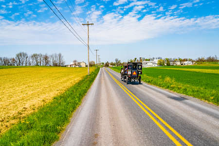 Amish country, wagon, farm, home and barn on field agriculture in Lancaster, Pennsylvania, PA US North Americaの写真素材