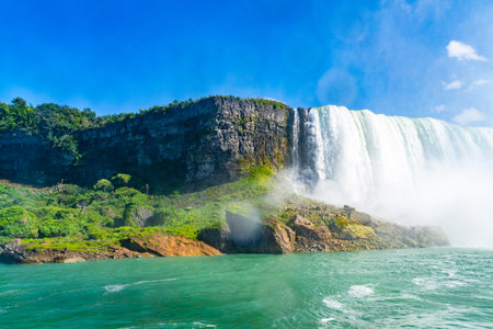View on the Bridal Veil Falls and American Falls of the Niagara Falls, the part of Goat Island, the Cave of the Winds Lookout, stairs and platforms, wooden walkways, Niagara Falls, New York, USA High quality photo.の写真素材
