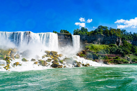 View on the Bridal Veil Falls and American Falls of the Niagara Falls, the part of Goat Island, the Cave of the Winds Lookout, stairs and platforms, wooden walkways, Niagara Falls, New York, USA High quality photo.の写真素材