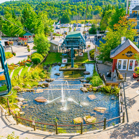 Mont Tremblant, Quebec, Canada - September 8, 2022: A lift ride by cable Car over the Mont Tremblant village Ski Resort from Mountain sugar shack place. High quality photoのeditorial素材