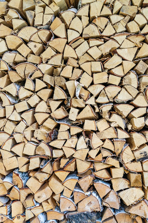 Stacked Firewood Texture - Neatly Organized Log Pile.の写真素材