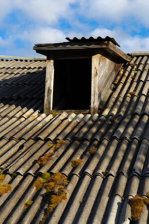 The attic of the old house windowの写真素材
