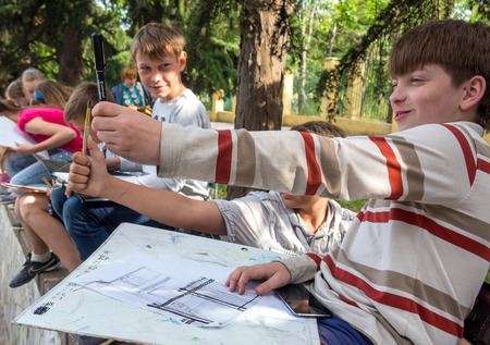 Alushta, Russia - June 09, 2016: Young artist determines the proportions with a pencilのeditorial素材