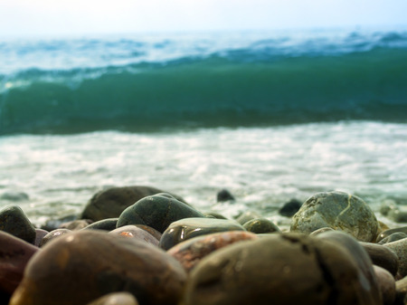 Sea wave rolled on the pebble beachの写真素材