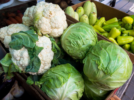 Cardboard boxes with vegetables on a street point of saleの写真素材