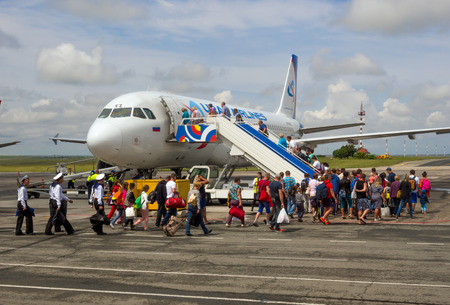Simferopol, Russia - June 15, 2016: Passengers go on board the aircraft of airline "Ural Airlines" for the airfield airport of Simferopol, Crimeaのeditorial素材
