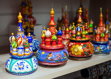 Moscow, Russia - February 12, 2016: Wooden souvenirs in the form of temple of Vasily Blazhenny stand on a shelf souvenir shopのeditorial素材