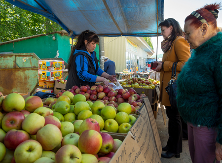 Voronezh, Russia - May 13, 2017: Women buy apples at theのeditorial素材