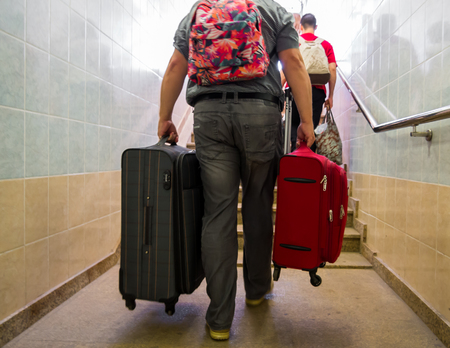 Voronezh, Russia - August 05, 2018: People with things climb the underpass stairsのeditorial素材