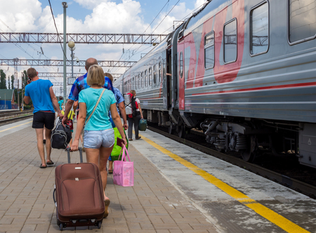 Voronezh, Russia - August 05, 2018: Passengers go along the platform to their wagonのeditorial素材