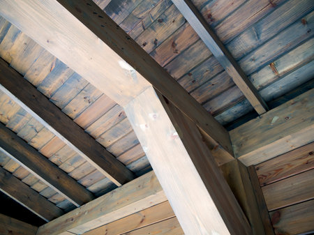 Wooden support beam and roof lathing riveted to itの写真素材