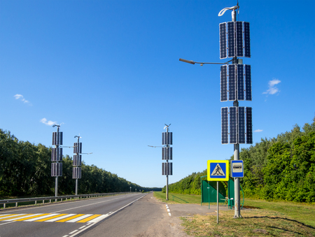 Using solar panels to illuminate a stretch of roadの写真素材