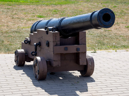 Old ship cannon on a wooden carriage