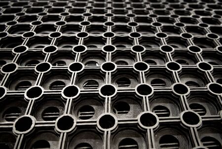Fragment of cellular rubber mat for dirt removalの写真素材