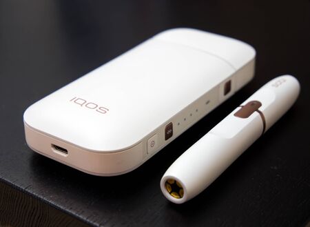 Voronezh, Russia - March 24, 2019: IQOS - a system for smokers, replacing cigarettesのeditorial素材