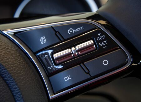 Cruise control buttons on the steering wheelの写真素材