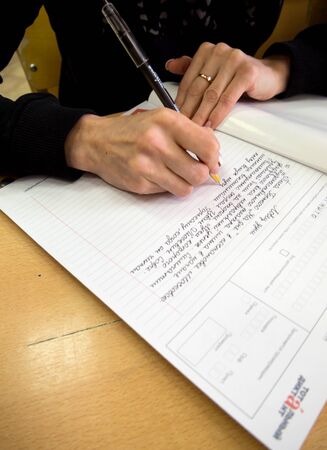 Gadjievo, Russia - April 13, 2019: Human writes "Total dictation" on letterheadのeditorial素材