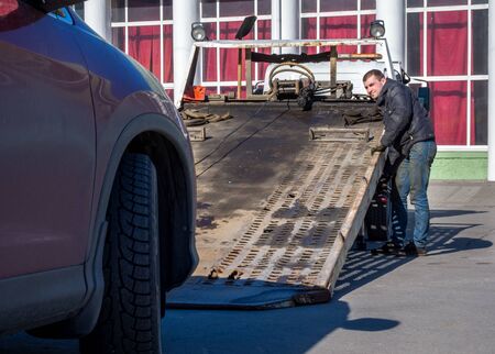 Murmansk, Russia - April 22, 2019: The car is being prepared for loading onto a tow truckのeditorial素材
