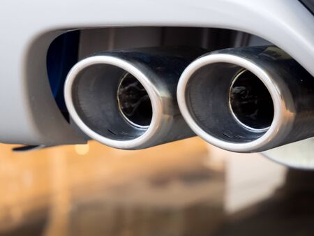 Double exhaust design solution in a conventional carの写真素材