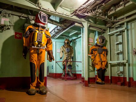 Novorossiysk, Russia - August 01, 2019: Figures in diving suits in the corridors of the cruiser-museumのeditorial素材