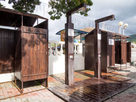 Kabardinka, Russia - August 8, 2019: Changing cabins and a shower room on the central beach of Kabardinkaのeditorial素材