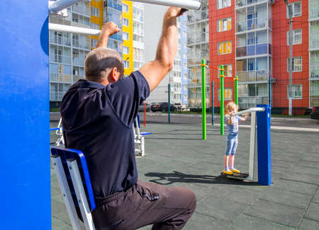 Voronezh, Russia - August 29, 2019: Girl and granddaughter on the playground in the courtyard of a new residential complexのeditorial素材